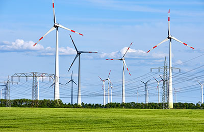 Wind power plants and overhead power lines seen in Germany